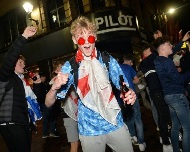 Leicester, Leicestershire, UK 7th July 2021. UK News. Football fans celebrate in Leicester City Centre after England beat Denmark to reach the final of Euro 2020. Alex Hannam